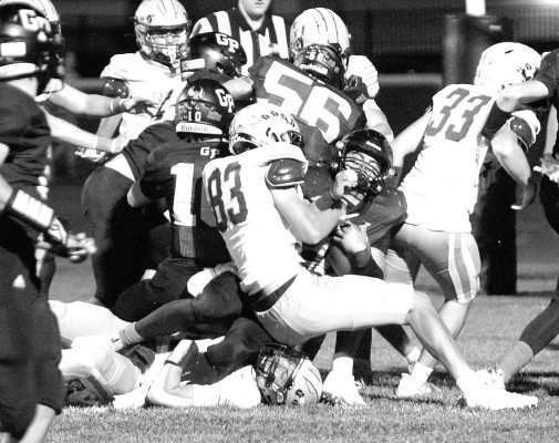 Clearwater Indians defender Mason Smith (83) fights to keep the Garden Plain Owls’ Emrick Hays out of the end zone during the teams’ non-district game last Thursday. The Owls won a defensive battle 23-6. Travis Mounts/TSnews