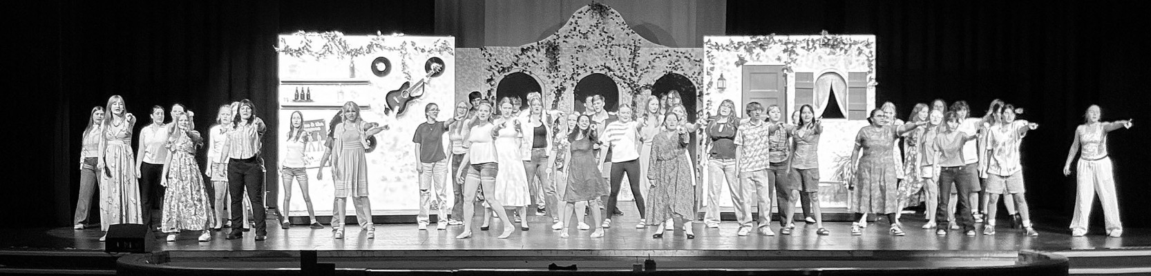 Cast members rehearse a scene for this weekend's production of “Mamma Mia!” at Eisenhower High School. Contributed photo