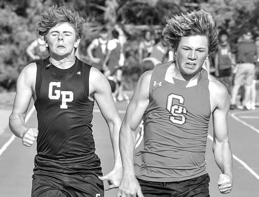 Wyatt Stuhlsatz of Garden Plain, left, and Conway Springs’ Kadyn Madi go head-to-head in a heat of the 100-meters at last week’s Wayne Pipkin Invitational track and field meet in Garden Plain. John Bloomquist/Contributed photos