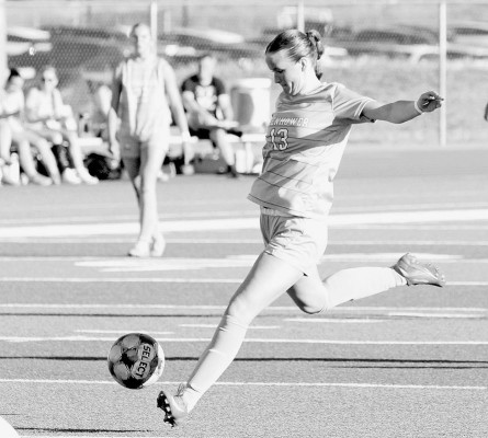 Reagan Best of the Eisenhower Tigers take a shot during the first half of the championship game in last weeks GHS-EHS soccer tournament. Eisenhower beat Garden City 2-0 for the win. Travis Mounts/TSnews