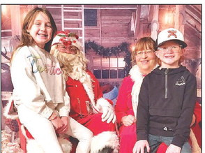 Lynnon and Lawson Coley visit with Santa and Mrs. Claus at Santa Day, held Saturday in Argonia. Several communities held holiday events on Saturday. Turn to Pages A4-A5 for more. Emily Coleman/Contributed photo