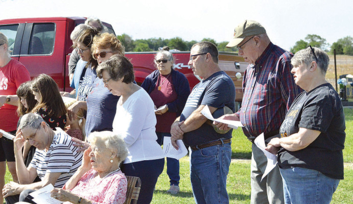 The crowd gathered for Monday’s Memorial Day ceremony at Viola Cemetery sings “America, the Beautiful” to close out the ceremony. The ceremony was one of several held in communities around the area. Paul Rhodes/TSnews