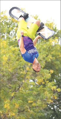 An entertainer with Flippenout Trampoline performs at Riggs Park on Saturday during the Haysville Fall Festival. See more photos on Page A8. Stephanie McKennon/TSnews