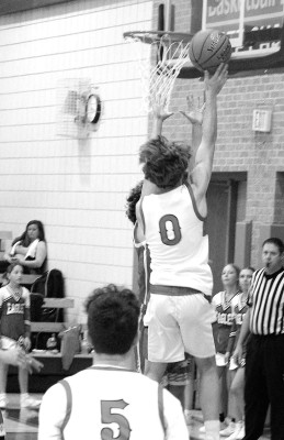 Silas Boetcher drives to the basket during last week’s Border Queen Tournament game against Udall. Sarah Vineyard/Contributed photo