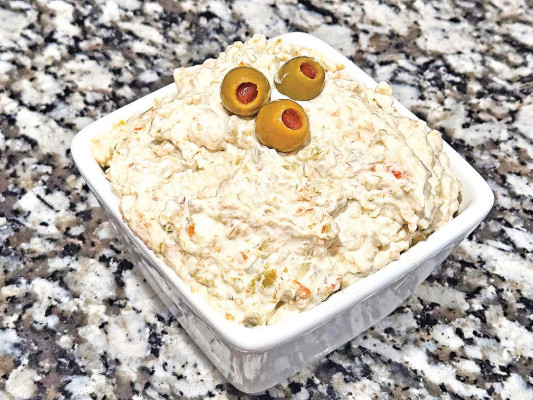 Green olive dip is super easy to make, coming together in a matter of minutes. With a creamy, brine-y flavor, it’s great with everything from crackers to fresh vegetables.