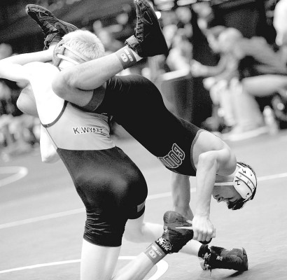 Oscar Gauna keeps hold of an opponent’s foot during a 113-pound match on Friday at the Class 5A State wrestling tournament, held in Park City. Gauna repeated as a State champion, and is a three-time State medalist. Dale Stelz/TSnews