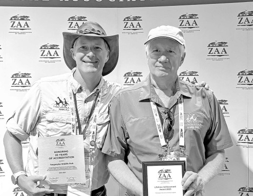 Jim Fouts, right, is pictured with his son, Matt. Jim Fouts founded Tanganyika Wildlife Park and has received a lifetime achievement award for his efforts in animal conservation. Matt Fouts is the current director of the park. Contributed photo