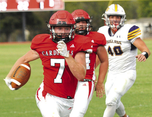 Isaac Winter breaks free for a big run during Conway Springs’ victory over Douglass on homecoming night. The Cardinals beat the Bulldogs 42-0, and Winter scored two touchdowns. Dale Stelz/TSnews
