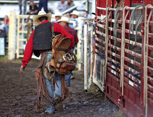 This photo, “End of the ride,” captured a cowboy carrying his saddle out of the Haysville Rodeo Arena during the 2022 PRCA rodeo. It won first place for feature photo. Stephanie McKennon/TSnews