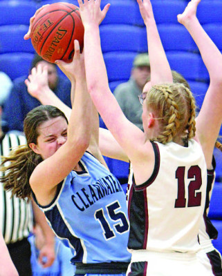 Kaylynn Konkel battles two Sunrise defenders in the Ralph Miller Classic championship. Travis Mounts/TSnews