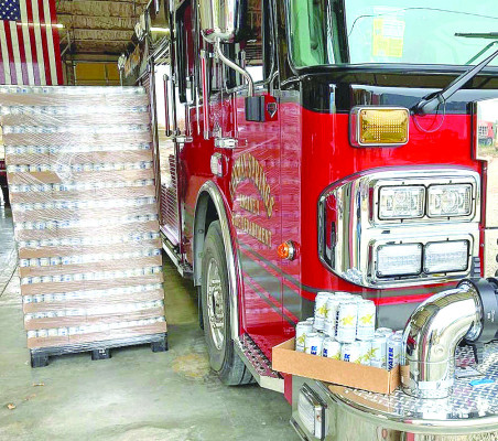 The Conway Springs Fire Department received 92 cases of cans of water from Anheuser-Busch. Contributed photo/Conway Springs Fire Department.