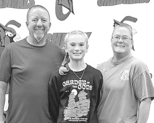 Quinnlan Dowell was the Kansas middle school champion and placed sixth nationally in the stock market game, an enrichment activity that teaches youth about investing. She is pictured with her parents, Eddie and Tonja Dowell. Contributed photo