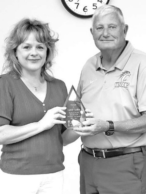 Mayor Burt Ussery presents Crystal Walter with a plaque recognizing her service on the city council. Walter, who is moving out of Clearwater, announced her resignation last week. Contributed photo