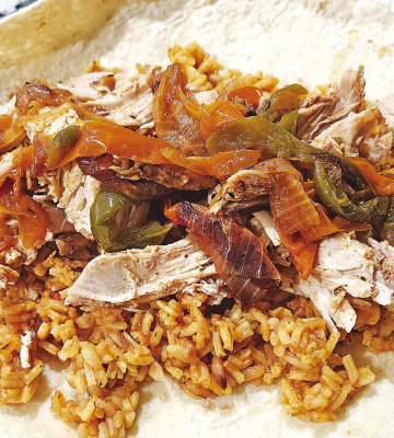 A whole chicken can be cooked quickly, along with sliced onions and bell peppers, to create a delicious, slightly spicy bird, perfect over rice, mashed potatoes or served inside a tortilla.