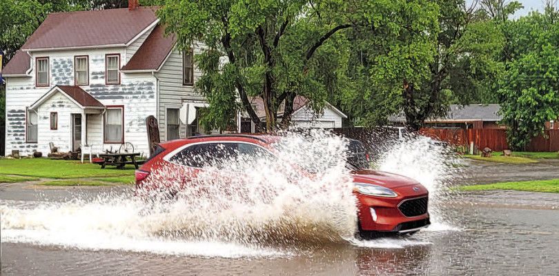 A vehicle makes a huge splash as it drives through a flooded area of Main Street in Cheney Tuesday morning. Rainfall across the area started before midnight, and continued through Tuesday morning and into the afternoon. Eisenhower National Airport had a record 2.56 inches, and at least that amount or more fell across the TSnews coverage area. Flash flood warnings were issued starting mid-afternoon. Valley Center saw around 7 inches. Paul Rhodes/TSnews