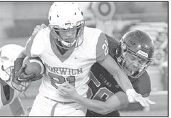 Tanner McCurley makes a tackle for the Titan’s during their homecoming win over Norwich. Travis Mounts/TSnews