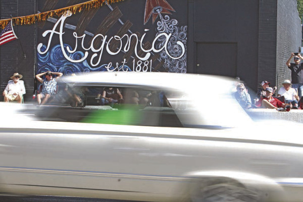 ABOVE: A car is a blur as it races through downtown Argonia. The community hosted its annual car show and street race on Saturday. More photos can be seen on Page B11. Travis Mounts/TSnews