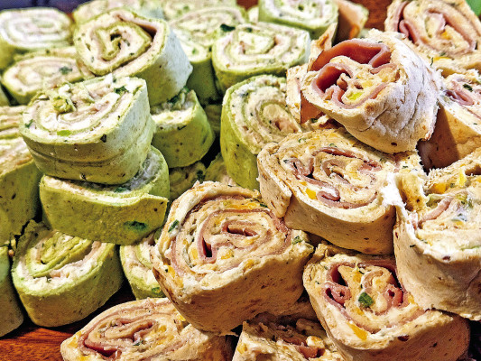 Tortilla rollups are a classic staple for the snack table. This recipe features ranch dressing mix as the main flavoring in cream cheese, along with shredded cheese and deli meat.