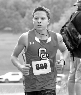 Gus Hemberger of Conway Springs runs in last Thursday’s varsity boys race at the Goddard Invitational, held at Lake Afton. He ran twice last week, also competing in the Wild Wind Festival that was hosted by Trinity Academy. Travis Mounts/TSnews