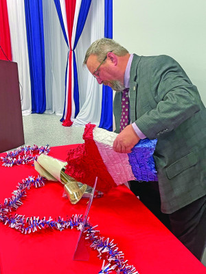 Haysville mayor Russ Kessler opens up a time capsule on Friday afternoon during the city’s celebration of 75 years since its incorporation on July 3, 1951. The time capsule was put together in celebration of the nation’s bicentennial. Travis Mounts/TSnews