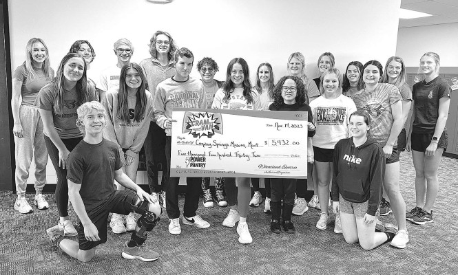 Student council members from Conway Springs High School pose with a check reflecting the total monetary donation generated by the Cardinals Care food drive and Power the Pantry campaigns for the Conway Springs Mission Mart. Students raised $5,432 and collected 1,252 food items. The effort is part of the statewide Cram the Van, organized by Wheatland Electric. In 10 years, the drive has collected more than 159 tons of food. Wheatland Electric/Contributed photo