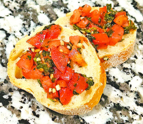 Bruschetta is a great summer appetizer, featuring tons of fresh flavors, from ripe tomatoes to bright basil and bursts of garlic.