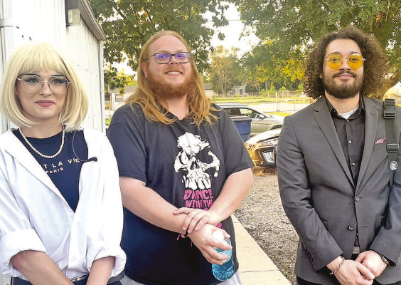 Hunter Gromala, left, visits with media following last week’s meeting of the Sedgwick County Fair Association. Also pictured are band members Nick Ramsey, center, and Ryan O’Neal. Travis Mounts/TSnews
