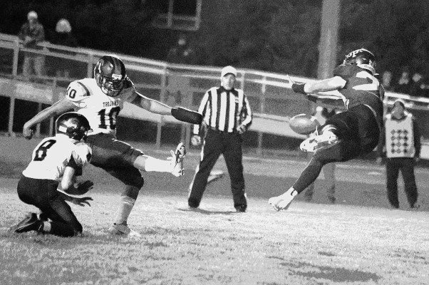 Pete McGregor blocks a Beloit kick during last Friday’s playoff game in Garden Plain. The Owls lost 19-0, but finished the season with an 8-3 record. Stephanie McKennon/TSnews