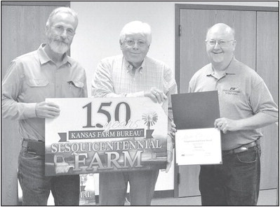 The Robert Mason family farm received an award for being owned by the same family for 150 years. The award was accepted by Michael Sloan and Kent Ott, who represented the family. Paul Rhodes/TSnews
