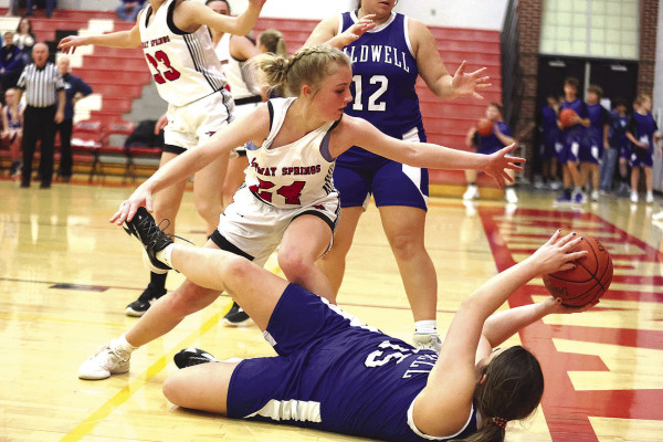 Ava Daniel tries to steal the ball from a Caldwell Bluejay during the Cardinals’ home win last week. Conway Springs won big, 60-17. Stephanie McKennon/TSnews