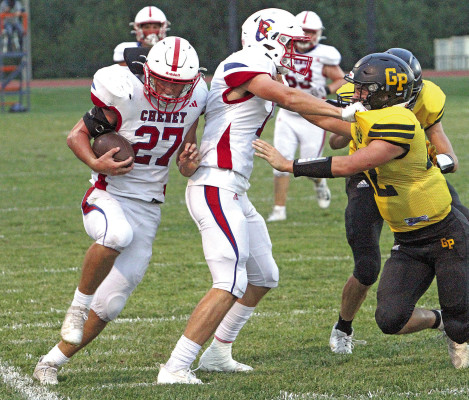 Cheney’s Kaden Ludwig gets a block from teammate Deitric McDaniel for a first-down run in the Cardinals’ win over the Garden Plain Owls.