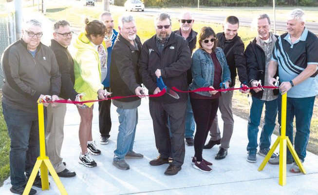 City officially opens new sidewalk