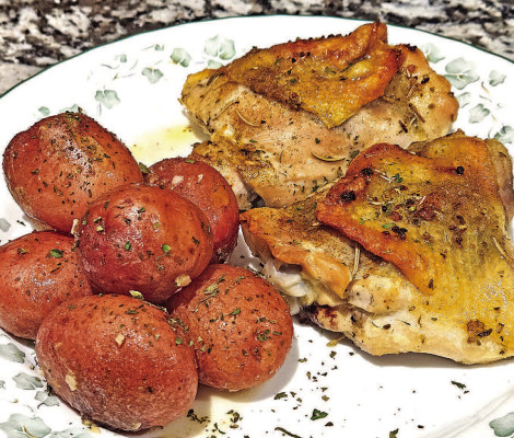 Lemon chicken and potatoes features wellseasoned chicken thighs atop petite red potatoes that roast in a combination of seasonings, lemon juice and olive oil for a delicious, hearty dinner that gives a nod to traditional Greek potatoes.