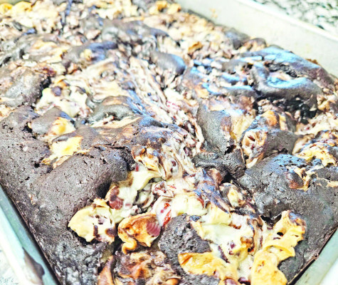 Amazing cake has too many ingredients to put in its title. It features an easy base of a boxed cake mix, elevated by pecans, shredded coconut, chocolate chips and a swirled cream cheese mixture that is not to be missed.