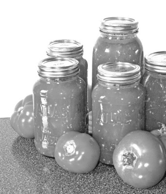 Removing tomato skins before canning can improve the taste and texture of the final product. Metro Creative