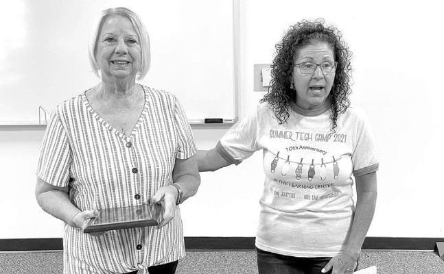 Dana Haislett, left, longtime Haysville Chamber of Commerce member and former president, was recognized last week for her long history of service to the organization. Also pictured is Chamber treasurer Penny Schuckman.
