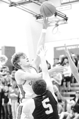Conway Springs’ Nash Johnsen scores 2 of his team-high 13 points during last Friday’s homecoming game. Travis Mounts/TSnews