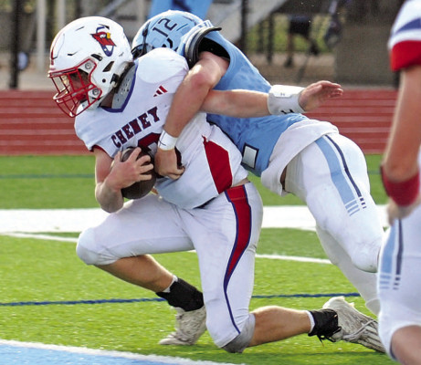 Josh Burdick of Cheney gets a touchdown for the Cardinals while Clearwater Indians’ defender Landon Woods brings Burdick to the ground. Dale Stelz/TSnews