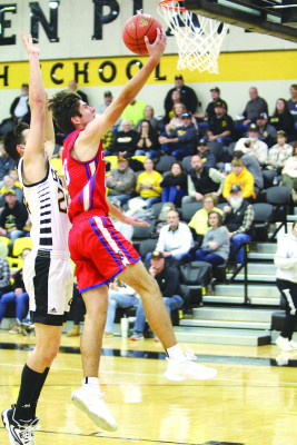 Jase Robertson of Cheney drives to the basketball while guarded by Garden Plain’s Gabe Kampling. Travis Mounts/TSnews