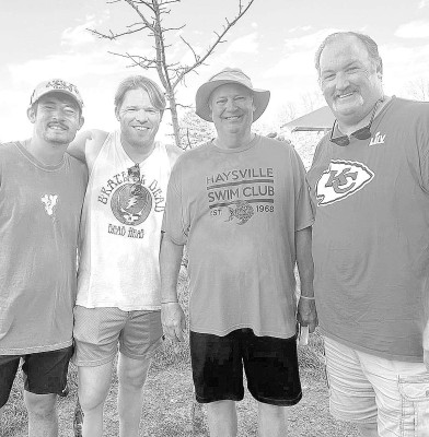Kelly Kennedy, at right, is stepping down as head coach of the Haysville Piranhas swim club. He has coached the team for 30 seasons. Pictured from left are assistants Blake Chadd, Daine Crum and Steve Crum. Contributed photo