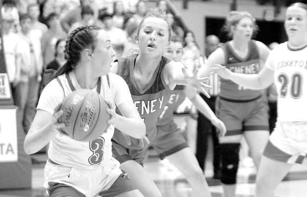 Raegen Black of Cheney covers Hesston’s Kendall Brueggen during the second half of last Thursday’s 3A State game at the Hutchinson Sports Arena. Travis Mounts/TSnews
