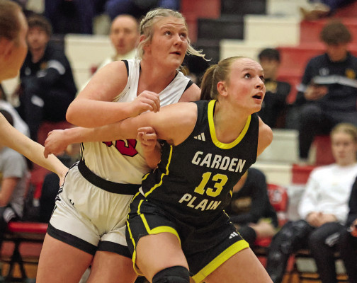 Macie Hartman of Conway Springs, left, tries to get around Garden Plain’s Jaden Stuhlsatz for a rebound during last Friday’s winter homecoming game in Conway Springs. Stephanie McKennon/TSnews