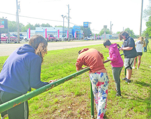 Cheney High School students were busy all around the area last Wednesday during a community service day. Here, a group of students were busy scraping and repainting the fence at Cherry Oaks Golf Course on the north edge of town. Other projects included picking up trash at Cheney Lake and working on cleanup projects at Souders Museum and Fairview Cemetery. Paul Rhodes/TSnews