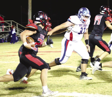 Carson Vineyard lookes for an opening in Pretty Prairie’s defense during Friday’s win for the Titans. Sarah Vineyard/Contributed photo