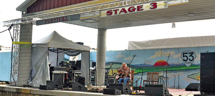 Musician Stephen Bennett performs the very first set on the new permanent Stage III at the Walnut Valley Festival. Paul Rhodes/TSnews