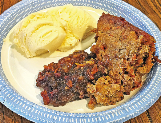 Carrot cake cobbler is like taking a carrot cake and marrying it with a pecan pie, and its warm spices and gooey filling demand a big scoop of vanilla ice cream for serving.