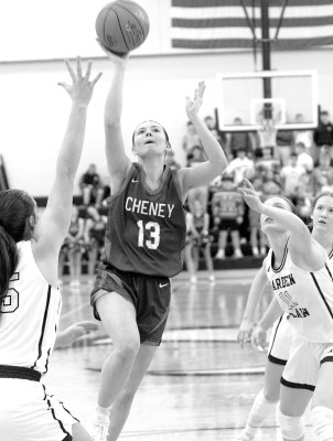 Cheney’s Karli Inslee drives through Garden Plain’s defense during the first half of Friday’s game. Cheney led by 10 points in the first half, fell behind Garden Plain by 7, and then came back to win. Travis Mounts/TSnews