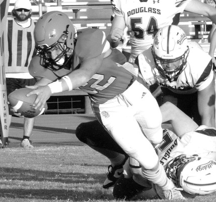 Gabriel Tarrant dives forward for extra yards during Conway Springs’ game against Douglass. Travis Mounts/TSnews