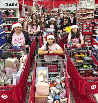 Haysville Middle School WEB students delivered more than $6,000 in gifts to Haysville Community Outreach. Contributed photo
