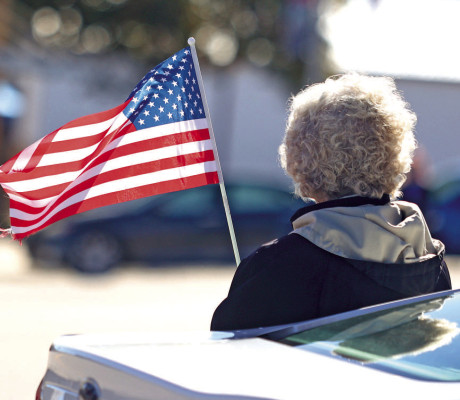 A woman waves an American flag during Saturday morning’s Veterans Day parade. The parade and a luncheon were put on by American Legion Post 295. Cheney schools held a ceremony last Friday, and other events took place in Haysville, Goddard, Conway Springs, Clearwater and Argonia. Stephanie McKennon/TSnews